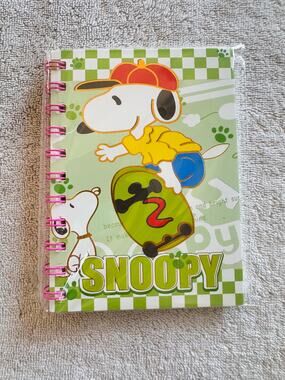 Snoopy peanuts riding a skateboard spiral notebook green lined sheets